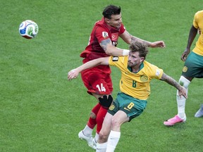 Australia's Connor Metcalfe fights for the ball with Turkey's Abdulkerim Bardakci .