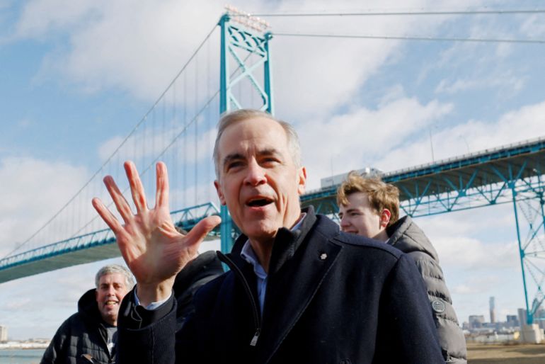 FILE PHOTO: Canada's Prime Minister Mark Carney gestures during a visit to the Ambassador Bridge linking Ontario with Michigan, as part of his Liberal Party election campaign tour, in Windsor, Ontario, Canada March 26, 2025. REUTERS/Blair Gable/File Photo