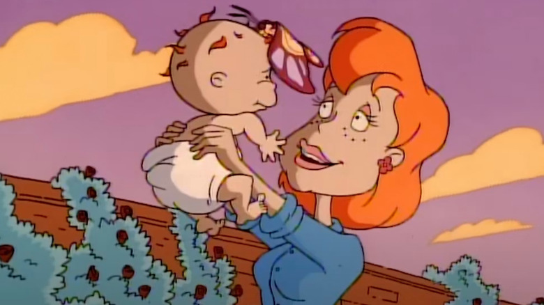 Chuckie (Christine Cavanaugh) is held by his late mother (Kim Cattrall) in Rugrats
