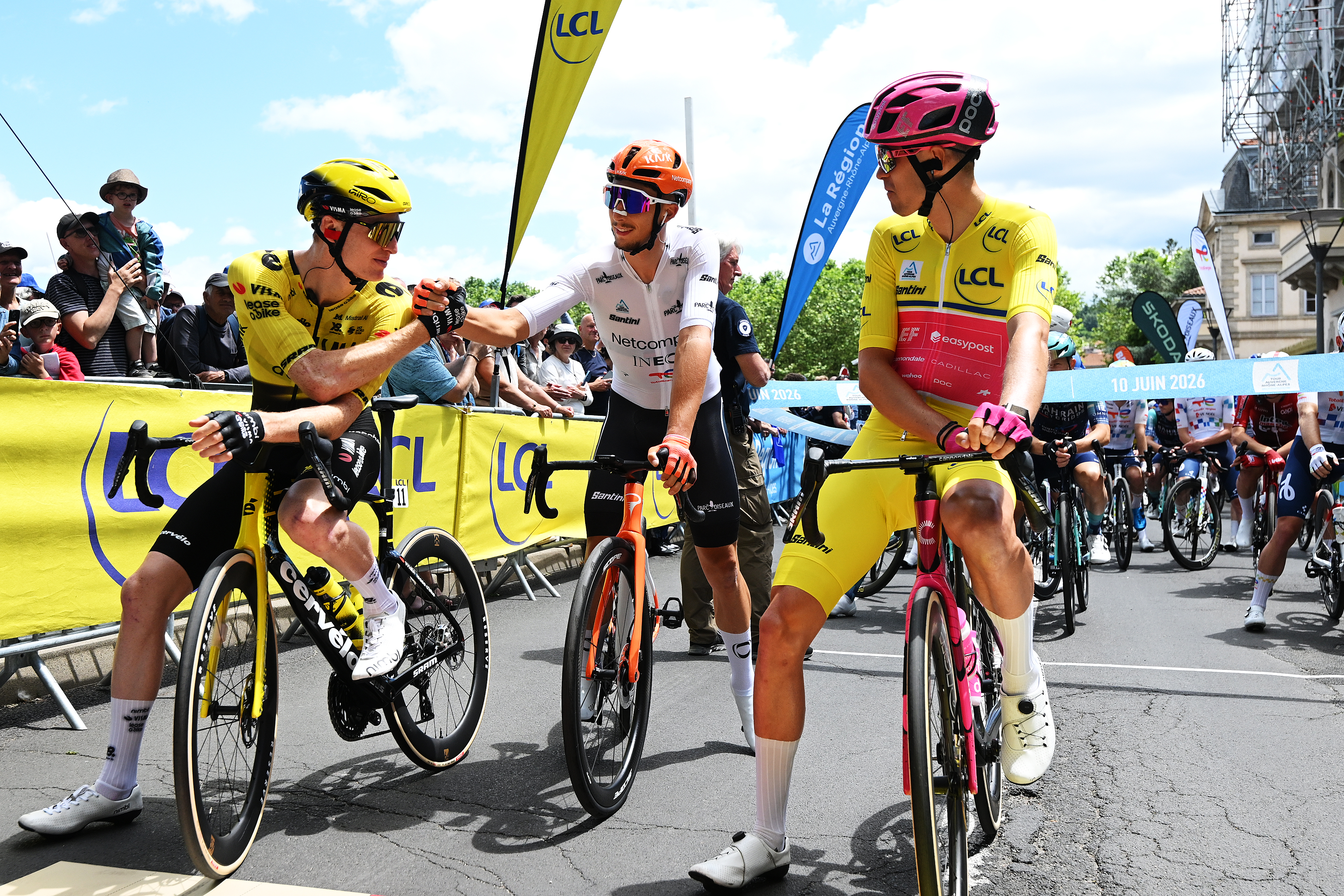 LE PUY-EN-VELAY, FRANCE - JUNE 10: (L-R) (L-R) Matteo Jorgenson of United States and Team Visma | Lease a Bike, Alex Baudin of France and Team EF Education - EasyPost - Yellow leader jersey and Kevin Vauquelin of France and Netcompany INEOS Cycling Team - White Best Young Rider Jersey prior to the 78th Tour Auvergne-Rhone-Alpes 2026, Stage 4 a 167.4km stage from Le Puy-en-Velay to Montrond-les-Bains / #UCIWT / on June 10, 2026 in Montrond-les-Bains, France. (Photo by Dario Belingheri/Getty Images)