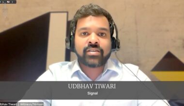 Man with headset speaking in a video call; caption shows 'UDHBHAV TIWARI' and 'Signal'