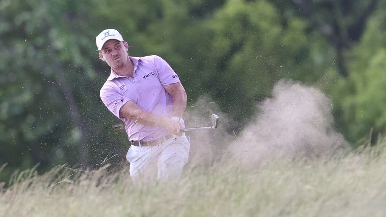 Bud Cauley hits from the deep rough on the 18th hole during the third round