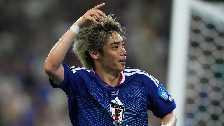 Japan's Junya Ito celebrates scoring against Tunisia
