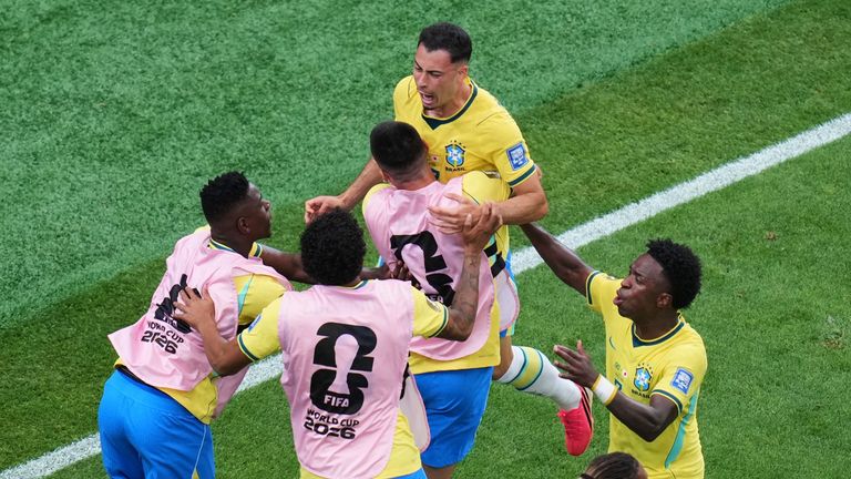 Martinelli is mobbed by his team-mates