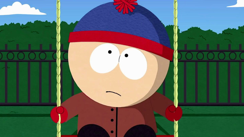Stan (Trey Parker) swings sadly in South Park