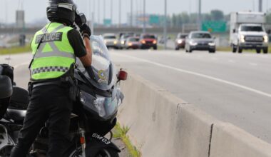 A Sûreté du Québec motorcycle officer takes part in a a road-safety program.
