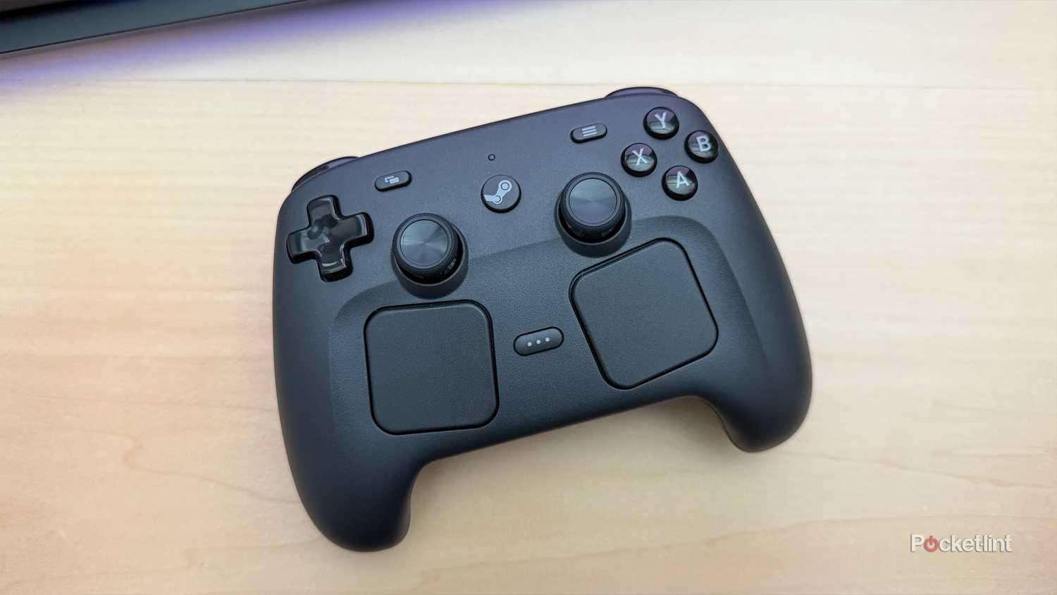 Steam Controller on desk.