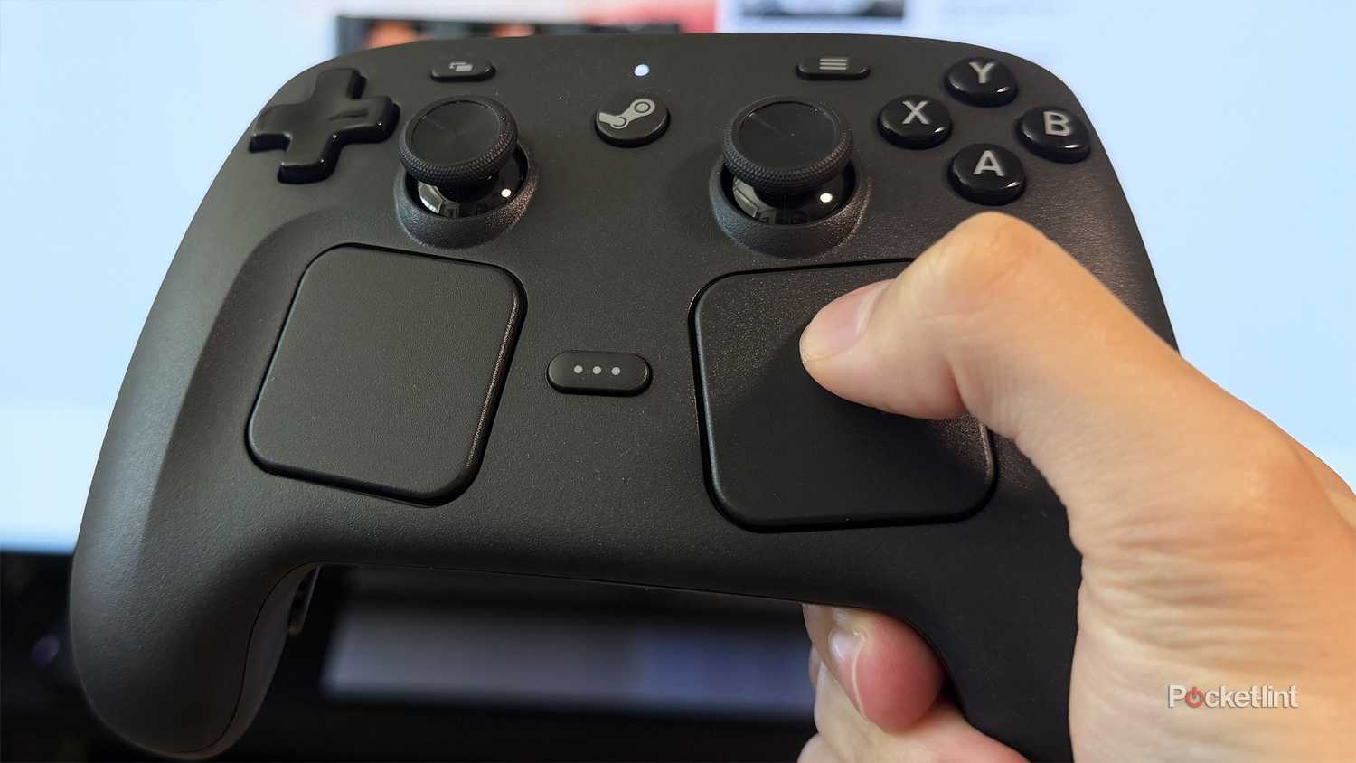 Person using trackpads on Steam Controller.