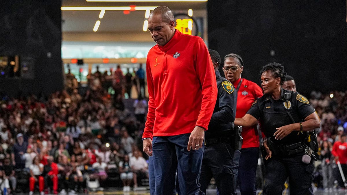 Washington Mystics head coach Sydney Johnson leaving the basketball court