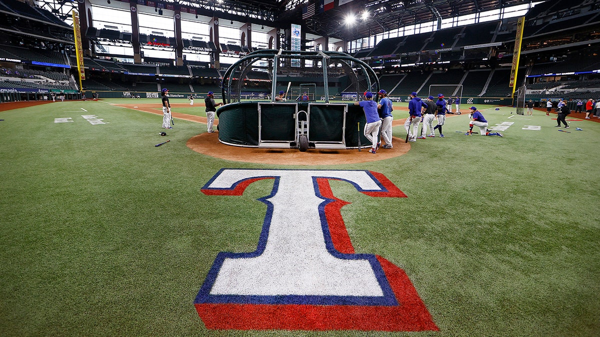 Texas Rangers players taking batting practice at Globe Life Field in Arlington, Texas