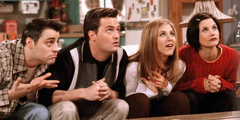 Joey, Chandler, Rachel, and Monica leaning in on 'Friends'