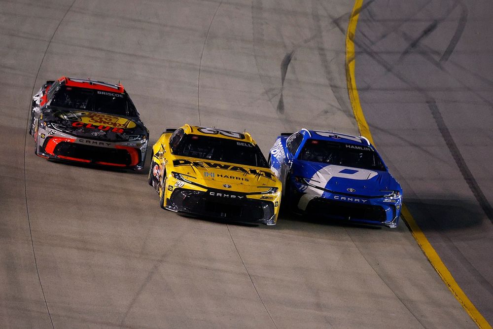 Three-wide battle for the win between Chase Briscoe, No. 19 Joe Gibbs Racing Toyota; Christopher Bell, No. 20 Joe Gibbs Racing Toyota; Denny Hamlin, No. 11 Joe Gibbs Racing Toyota