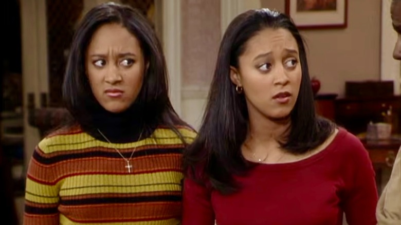 Tia and Tamera looking perplexed while speaking to Roger