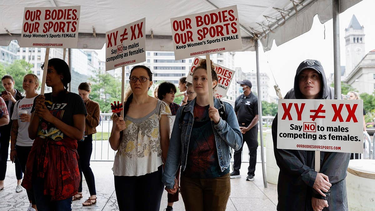 Demonstrators listening to speakers at Title IX rally at Freedom Plaza in Washington, D.C.
