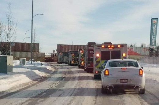 A shot of emergency vehicles being blocked from entering the Maple Crest community in southeast Edmonton.