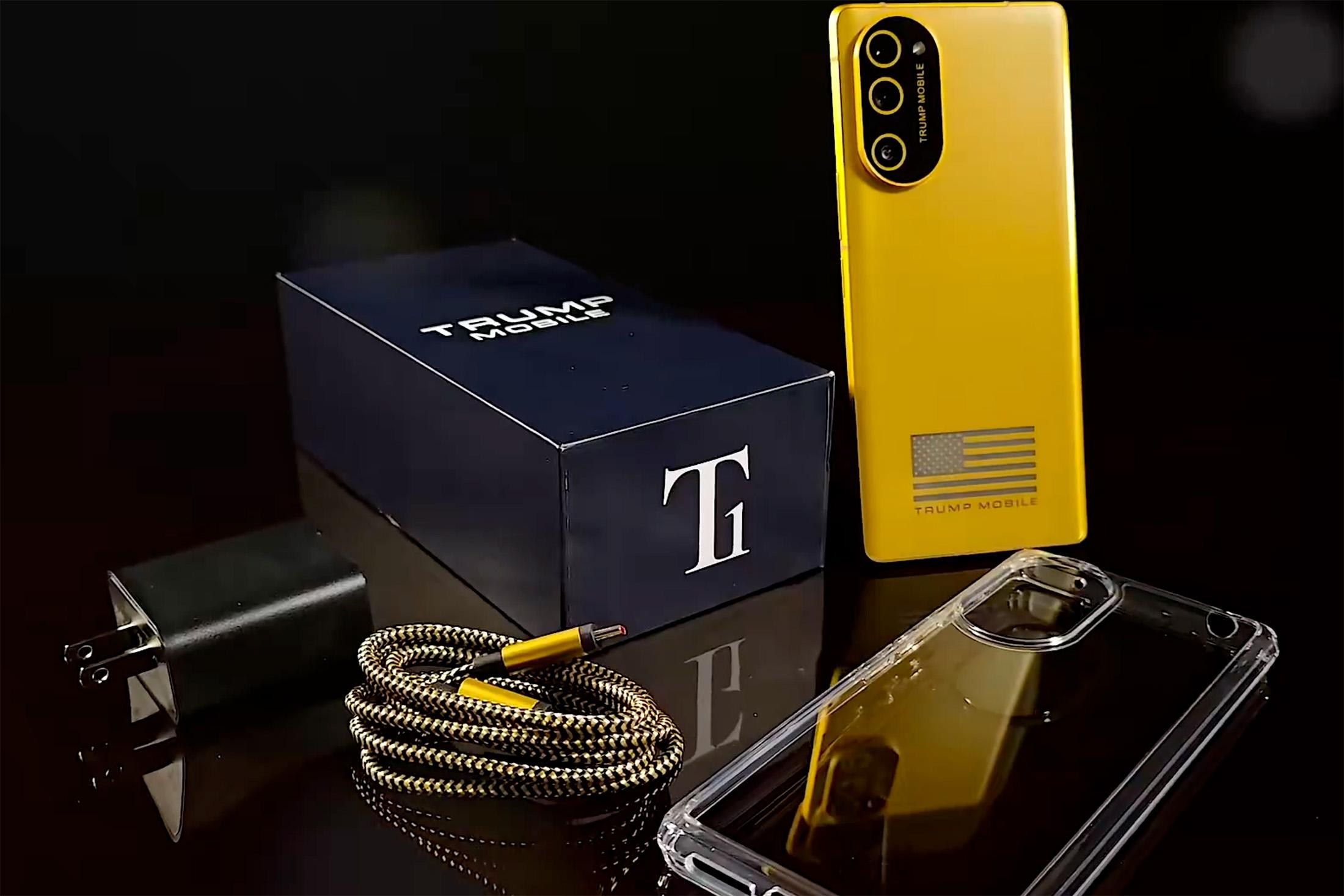 A still from Trump Mobile’s promotional video showing the T1 Phone surrounded by the accessories it ships with.