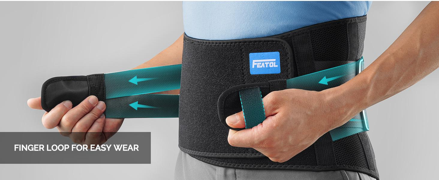 User adjusting a FEATOL lower back brace with reinforced support straps for customized lumbar compression.