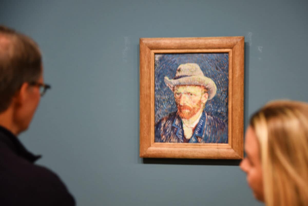 Amsterdam, Netherlands. January 2023. Visitors admiring a self portrait of Vincent van Gogh.