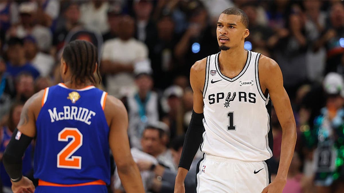 Victor Wembanyama #1 of the San Antonio Spurs reacts