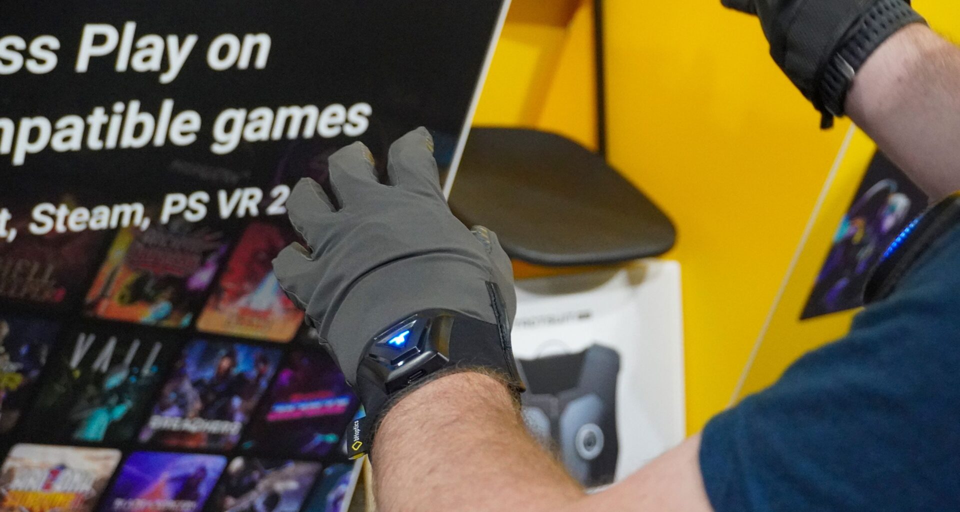 I tried out the latest version of the most advanced haptic VR vest and gloves, and it's more immersive than ever
