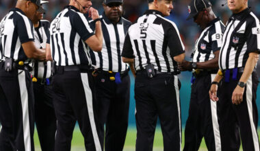 MIAMI GARDENS, FLORIDA - DECEMBER 11: NFL referees huddle during the fourth quarter of a game between the Tennessee Titans and Miami Dolphins at Hard Rock Stadium on December 11, 2023 in Miami Gardens, Florida.