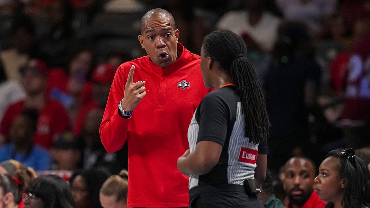 Washington Mystics head coach Sydney Johnson reacting during a basketball game