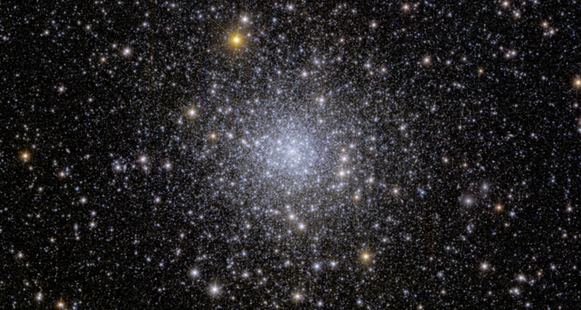 A glittering bundle of stars against the darkness of space.