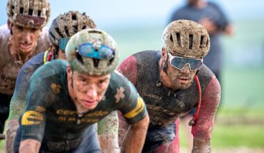 Matthew Wilson (right) riding in a group during the mud of Unbound 200 2026