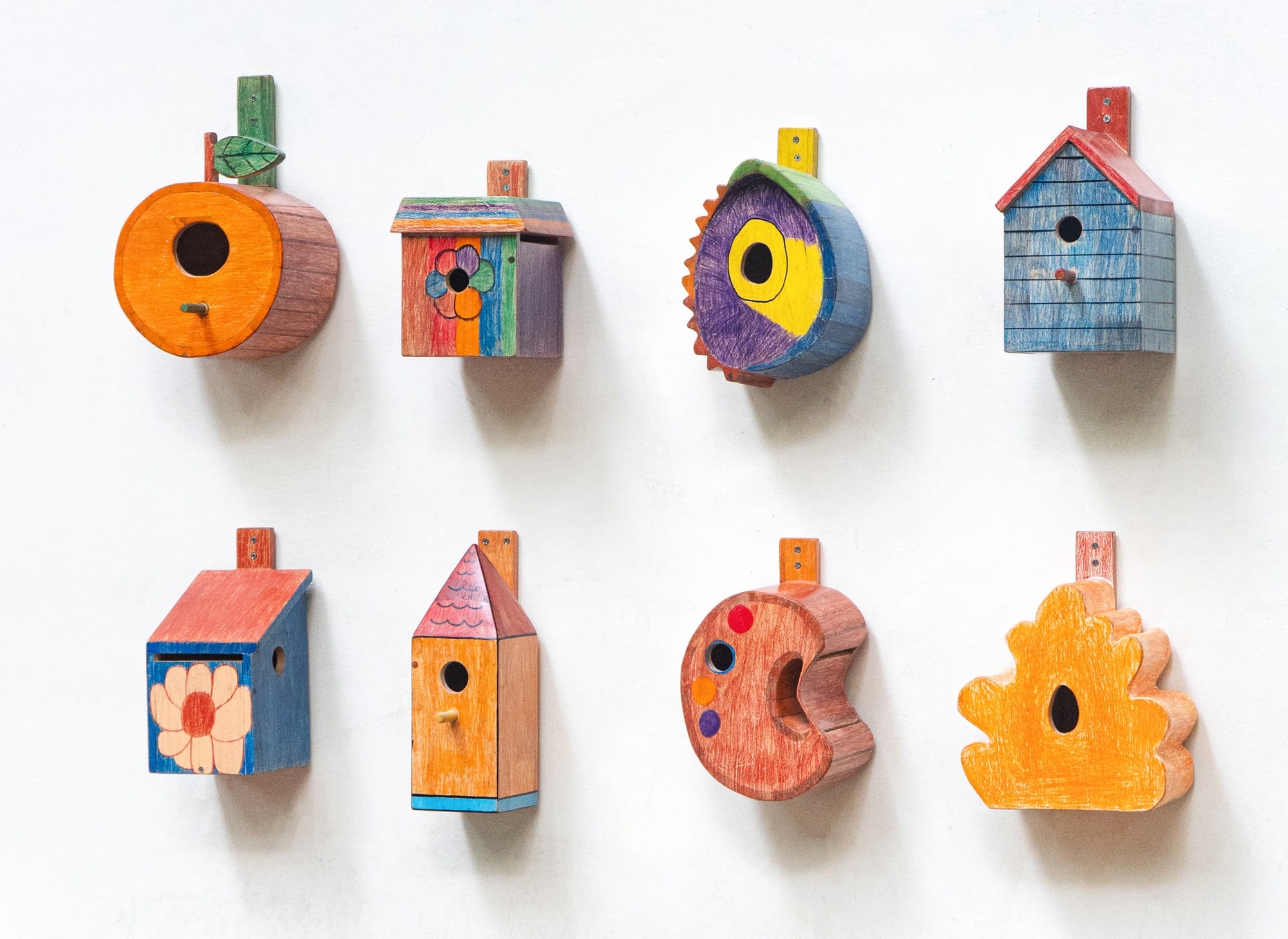 a series of colorful, whimsical birdhouse designs conceived by children and created by Taekhan Yun