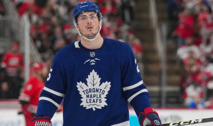 Zach Werenski wearing a Toronto Maple Leafs home jersey in NHL trade rumor image linking the Columbus Blue Jackets defenseman to Toronto