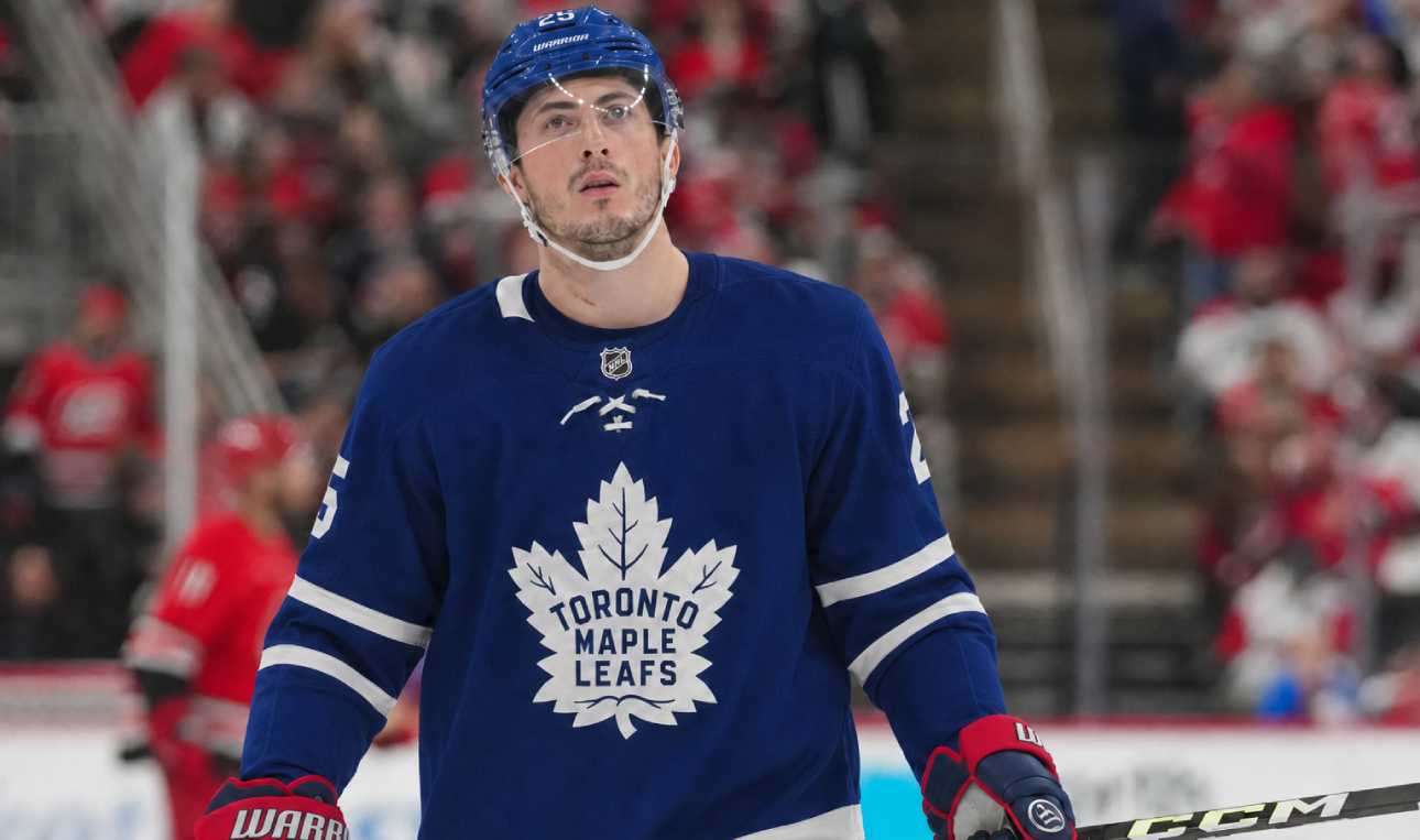Zach Werenski wearing a Toronto Maple Leafs home jersey in NHL trade rumor image linking the Columbus Blue Jackets defenseman to Toronto