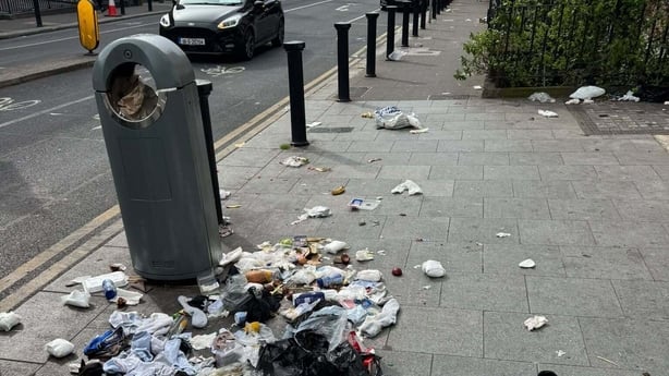 Items pulled out of a bin due to people searching for bottles for Return 
