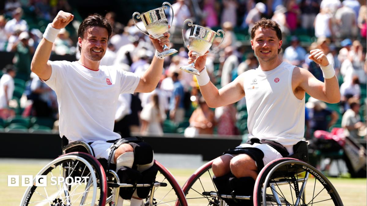 Gordon Reid and Alfie Hewett hold their Wimbledon trophies aloft