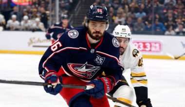 Apr 12, 2026; Columbus, Ohio, USA; Columbus Blue Jackets right wing Kirill Marchenko (86) and Boston Bruins defenseman Jonathan Aspirot (45) skate after a loose puck during the first period at Nationwide Arena. Mandatory Credit: Russell LaBounty-Imagn Images