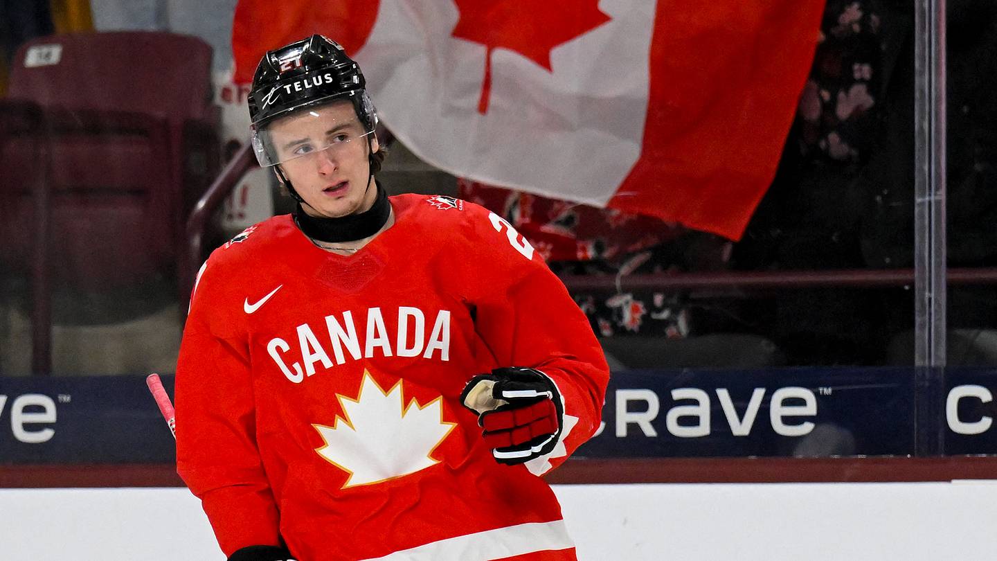 Jan 2, 2026; Minneapolis, Minnesota, USA;  Canada forward Cole Reschny (21) celebrates his goal against Slovakia during the first period in the quarterfinals of the 2026 IIHF World Junior Championship at 3M Arena. Mandatory Credit: Nick Wosika-Imagn Images