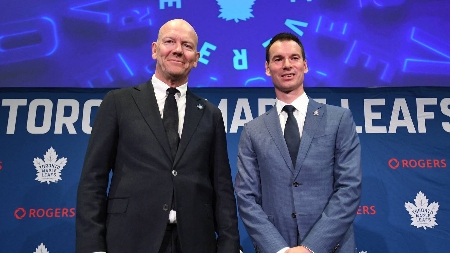 May 4, 2026; Toronto, Ontario, CANADA;  Toronto Maple Leafs new senior executive advisor Mats Sundin (l) and general manager John Chayka pose for picture after an introductory news conference at Real Sports Bar and Grill. Mandatory Credit: Dan Hamilton-Imagn Images