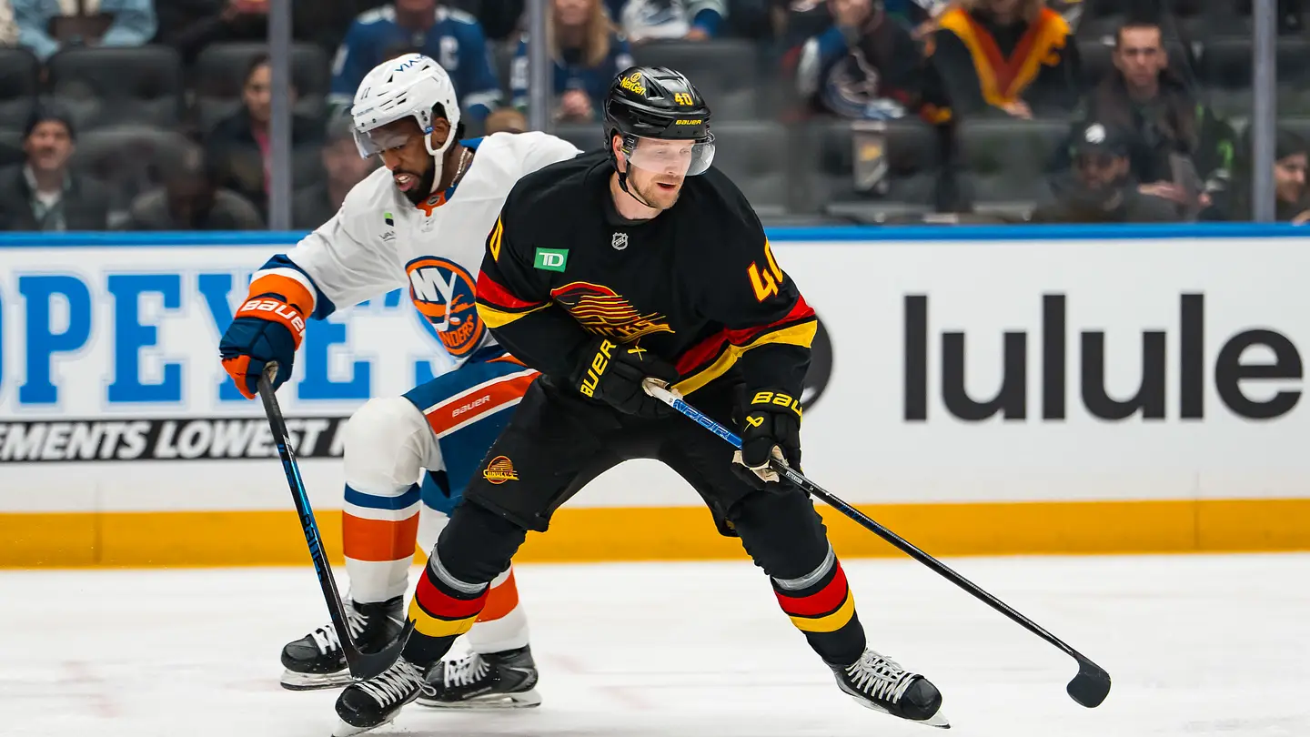 Jan 19, 2026; Vancouver, British Columbia, CAN; New York Islanders forward Anthony Duclair (11) battles with Vancouver Canucks forward Elias Pettersson (40) in the first period at Rogers Arena. Mandatory Credit: Bob Frid-Imagn Images