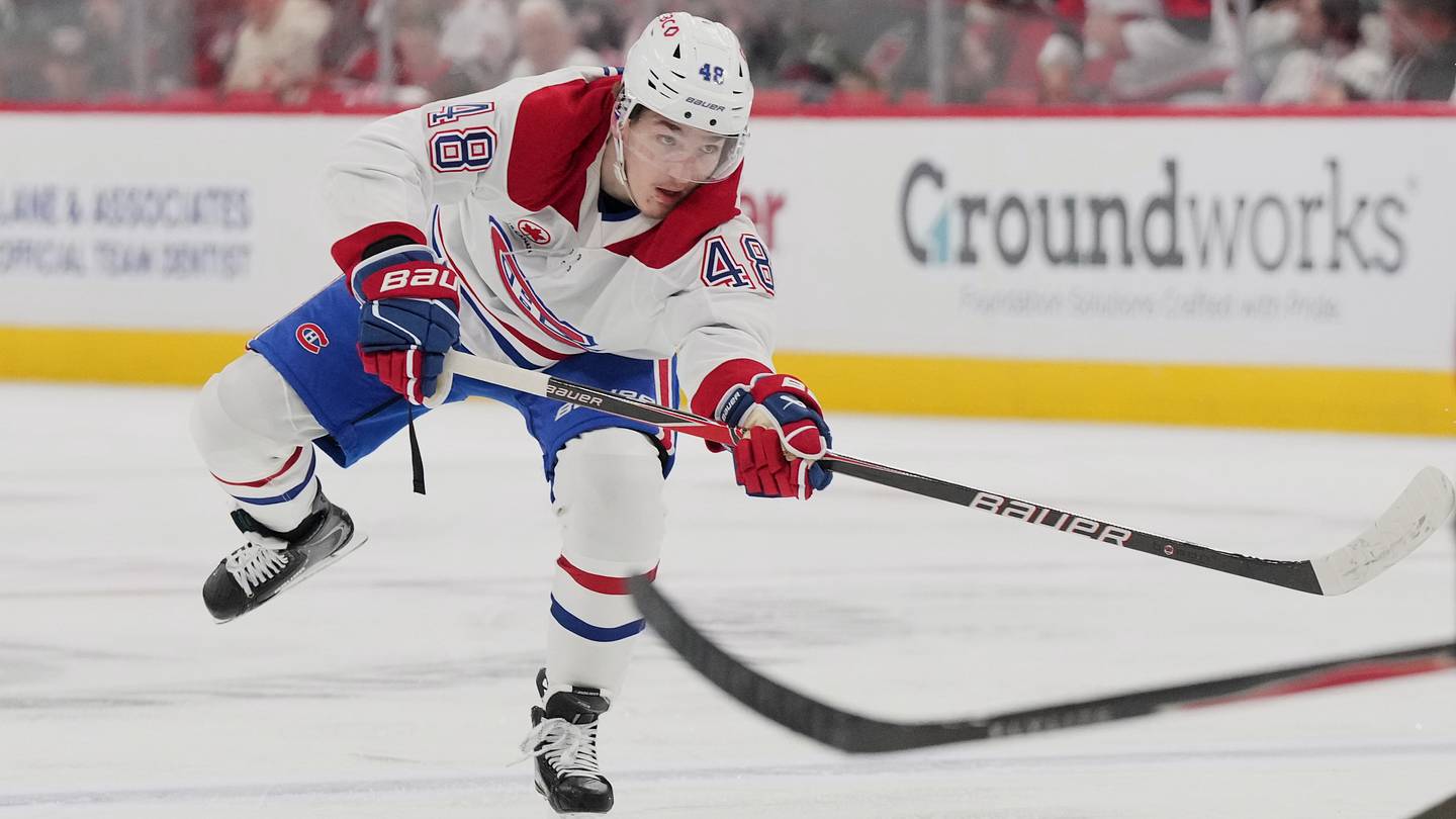 May 29, 2026; Raleigh, North Carolina, USA; Montreal Canadiens defenseman Lane Hutson (48) shoots the puck against the Carolina Hurricanes in game five of the Eastern Conference Final of the 2026 Stanley Cup Playoffs during the second period at Lenovo Center. Mandatory Credit: James Guillory-Imagn Images