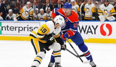 Jan 22, 2026; Edmonton, Alberta, CAN; Pittsburgh Penguins forward Connor Dewer (19) and Edmonton Oilers forward Connor McDavid (97) battle for a loose puck during the second period at Rogers Place. Mandatory Credit: Perry Nelson-Imagn Images