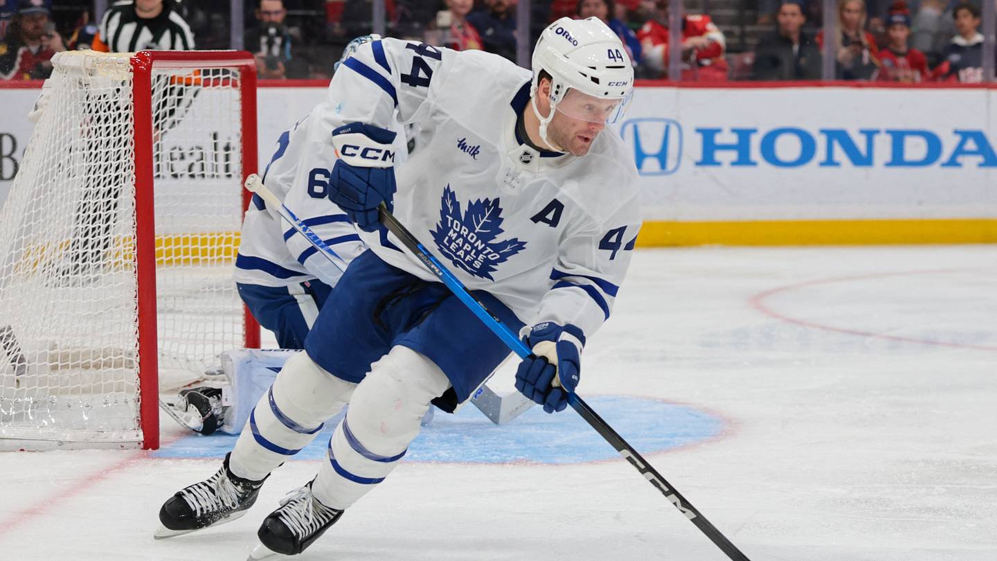 Feb 26, 2026; Sunrise, Florida, USA; Toronto Maple Leafs defenseman Morgan Rielly (44) moves the puck against the Florida Panthers during the third period at Amerant Bank Arena. Mandatory Credit: Sam Navarro-Imagn Images