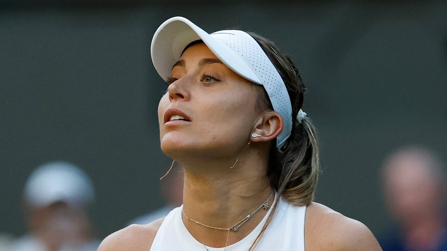 Paula Badosa looks to her player's box between points