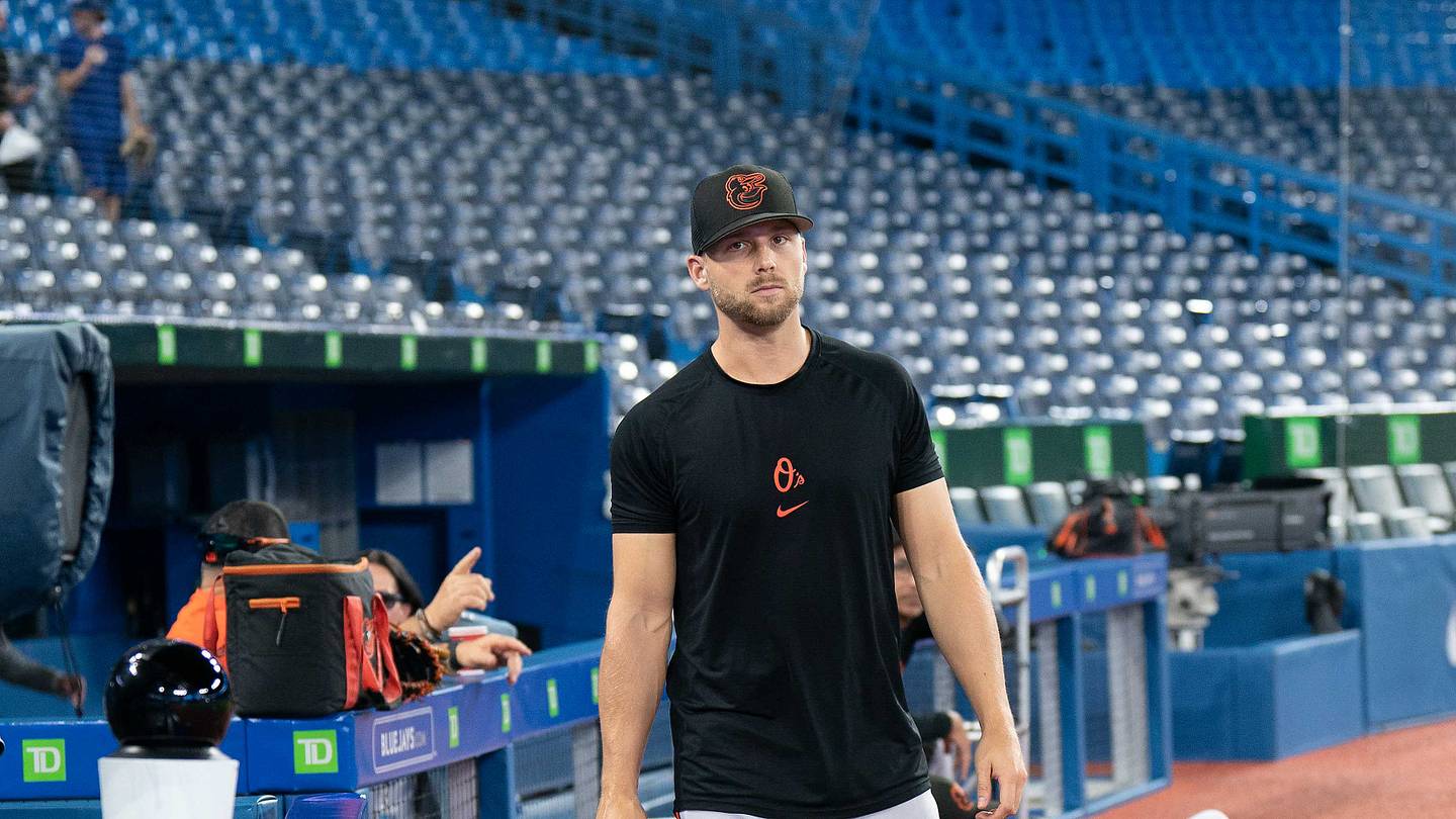 Aug 16, 2022; Toronto, Ontario, CAN; Baltimore Orioles starting pitcher Austin Voth (51) walks onto the field during batting practice against the Toronto Blue Jays at Rogers Centre. Mandatory Credit: Nick Turchiaro-USA TODAY Sports