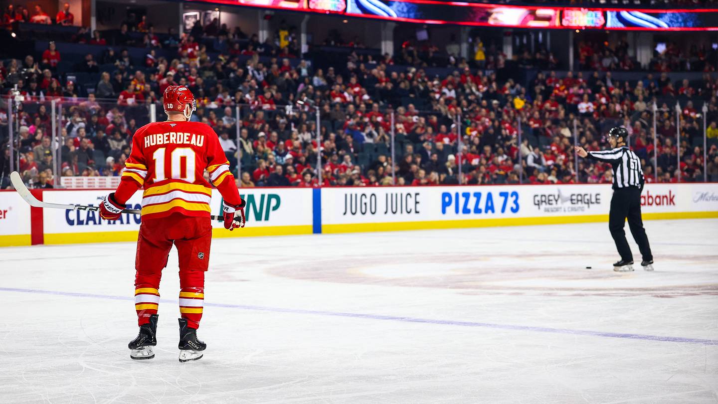 Jan 5, 2026; Calgary, Alberta, CAN; Calgary Flames left wing Jonathan Huberdeau (10) takes a penalty shot against the Seattle Kraken during the first period at Scotiabank Saddledome. Mandatory Credit: Sergei Belski-Imagn Images