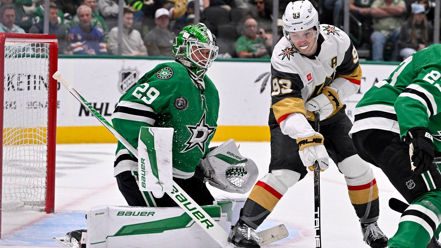Mar 10, 2026; Dallas, Texas, USA; Vegas Golden Knights right wing Mitch Marner (93) redirects the puck on Dallas Stars goaltender Jake Oettinger (29) during the third period at the American Airlines Center. Mandatory Credit: Jerome Miron-Imagn Images