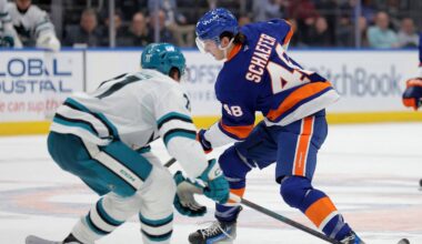 Oct 21, 2025; Elmont, New York, USA; New York Islanders defenseman Matthew Schaefer (48) skates with the puck against San Jose Sharks center Macklin Celebrini (71) during the second period at UBS Arena. Mandatory Credit: Brad Penner-Imagn Images