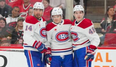 Mar 29, 2026; Raleigh, North Carolina, USA;  Montreal Canadiens center Nick Suzuki (14) is congratulated by defenseman Lane Hutson (48) and right wing Cole Caufield (13) after his goal against the Carolina Hurricanes during the second period at Lenovo Center. Mandatory Credit: James Guillory-Imagn Images