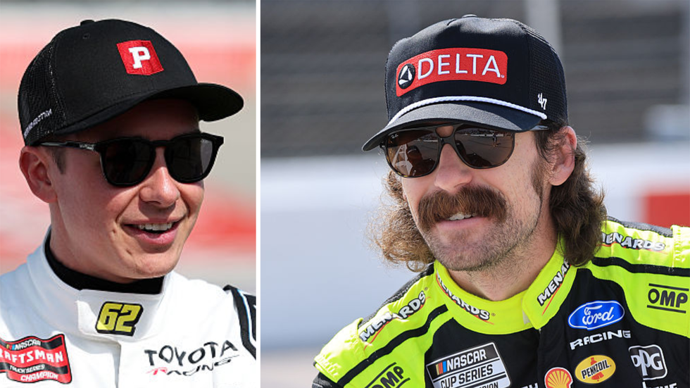 Two NASCAR drivers smiling, one in a black hat with 'P' and the other in a black hat with 'DELTA'. Two NASCAR drivers smiling, one in a black hat with 'P' and the other in a black hat with 'DELTA'.