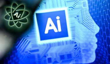 A photo taken on Jan. 2, 2025, shows the letters AI for Artificial Intelligence on a laptop screen next to the logo of the Chat AI application on a smartphone screen.