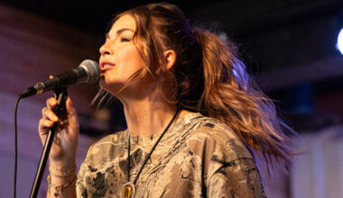 Jess Moskaluke performs on a stage.