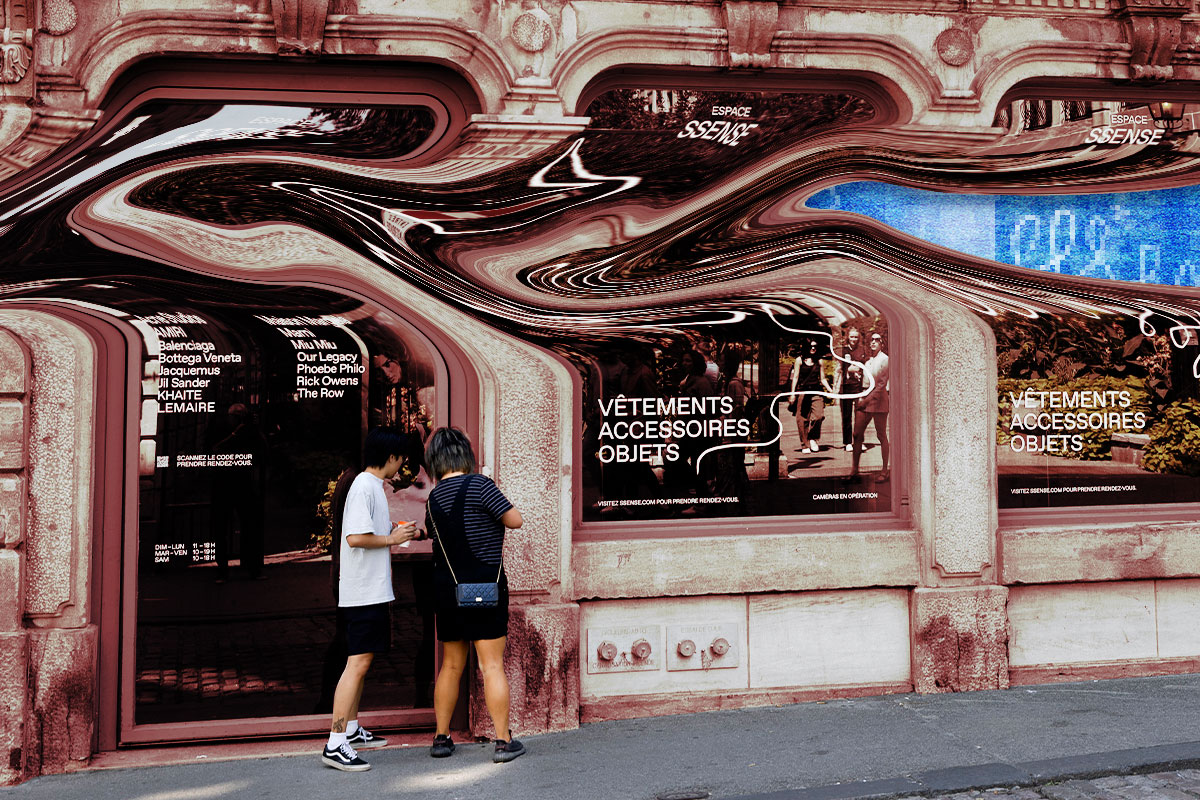 Two people stand in front of the Ssense store, which in this illustration has been artistically warped to reveal a pixellated layer behind the facade